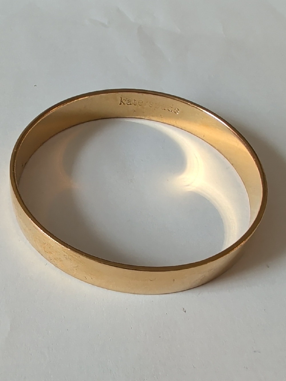 kate spade Gold Tone Smooth Signature Bangle Bracelet